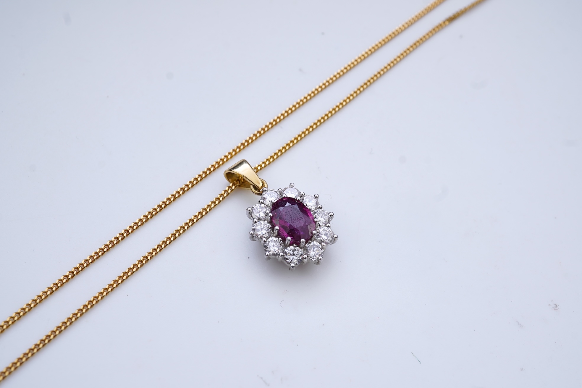 A ruby and diamond pendant